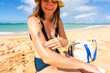 © Christine La/Stocksy - applying sunscreen
