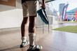 © Jovo Jovanovic/Stocksy - Injured soccer player holding cleats
