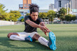 © Jovo Jovanovic/Stocksy - Soccer player warming up before practice