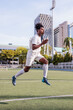 © Jovo Jovanovic/Stocksy - Soccer player jumping during warmups