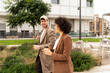 © Alba Studio/Stocksy - Coworkers Walking After Work