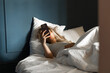 © Asya Molochkova/Stocksy - Young Woman Reading News on Phone in Bed Morning