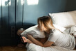 © Asya Molochkova/Stocksy - Using smartphone in the morning in bed