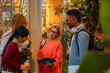 © VICTOR TORRES/Stocksy - Diverse coworkers discussing project in modern workspace
