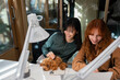 © VICTOR TORRES/Stocksy - Coworkers collaborating with a dog in modern office