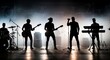 © Ilham - Silhouetted band performing on stage under atmospheric lighting