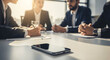 © Watcharapong - Modern Smartphone on a conference table On Conference Table Team Collaboration And Discussion in a modern office, Contemporary Office