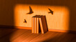 © Marcos Osorio/Stocksy - Imagination and escape with book and bird shadows in interior space