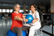 © Santi Nuñez/Stocksy - Senior woman doing physical therapy with physiotherapist