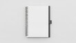 © Fenny - A spiral-bound notebook with a white cover and gray spine on a light gray background