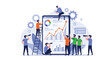 © Aminul - Creative team collaborating on a giant digital tablet to monitor business growth through analytics, charts, and binoculars.