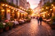 © Arham - blurred abstract background european street cafe evening outdoor dining string lights bokeh cobblestone walkway urban lifestyle summer night travel
