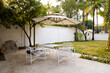 © Vahn - Outdoor of café shop and minimal view table desk white green environment and chair seating. Café concept.