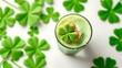 © oj - materialization. Green milkshake with whipped cream and clover cookie on white surface. menu design, packaging mockups, designed for food delivery and cloud-kitchen brand materials.
