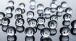 © SELIM - A cluster of round metal sewing buttons for fashion design features glistening drops of water on their steel surface