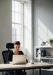 © BoldPixel - Woman Working on Laptop at Bright Desk by Large Window