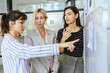 © chokniti - Business professionals discussing ideas in urban setting corporate communication teamwork consultation partnership strategy planning modern workplace collaboration