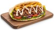 © tya - A delicious doner kebab sandwich with fries on a wooden board