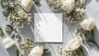 © PromptWorksStudio - Top view of white roses and blank square card on gray background
