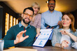 © djile - Business team analyzing data and planning strategy in a video meeting conference