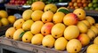 © Safarani - Fresh mangoes displayed for sale in a market environment