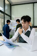 © NINENII - Stressed asian businessman working in the office. Businessman thinking too much work concept in the office.