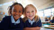 © Andrii - Celebrate diversity in education: two smiling young schoolgirls in navy uniforms sitting together in a bright classroom, for school marketing, childhood friendship themes, and inclusive learning