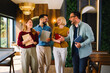 © djile - Business team walking together and talking in modern office interior