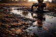 © pngking - Oil contamination on soil surface from well head leakage with copy space for text