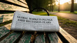 © lutfi - Newspaper with global market recession headline on wooden park bench