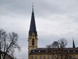 © Vladimir - Serene winter morning featuring weathered church with towering steeple and cobbled pathway
