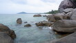 © Bendy Moe - A large rounded granite boulder sitting in the middle of shallow sea water. Beautiful clarity and color of the tropical ocean.