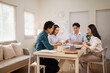 © David - Asian business team collaborating on project strategy in office
