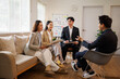 © David - Asian business professionals discussing ideas in office meeting