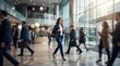 © Александр Михайлюк - Executive woman power-walking through a busy corporate lobby at morning rush, blurred colleagues and glass architecture