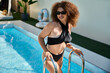 © Bliss - Joyful moments by the shimmering pool with a stunning plus size woman enjoying summer bliss
