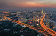 © AmazingAerialAgency - Aerial view of highways glow like fiery arteries through the urban sprawl towards the Landmark 81 skyscraper, Ho Chi Minh City, Vietnam.