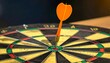 © Gstudieo - 'A symbolic success artwork showing a dartboard with alternating yellow and black sections and a central red and green bullseye. A single orange dart is precisely lodged in the bullseye, representing