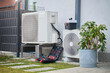 © Lazy_Bear - Outdoor heat pump units beside house with open toolbox and tools on ground. Concept of HVAC maintenance, residential climate control, repair and energy efficiency