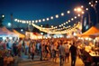 © Gantarang - Crowd at a lively outdoor market illuminated by string lights at dusk