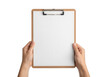 © Muksuda - A wooden picture frame held by hands against a plain background