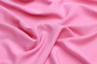 © Sceliano - Premium pink 100% natural viscose fabric texture with elegant, soft drapes. Lightweight, breathable textile background in vibrant colors. Ideal for fashion design, apparel manufacturing, and sewing.