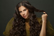© millaf (Nemchinova) - Fashionable brunette woman with long healthy hair on dark background