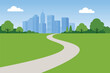 © vvadyab - City park landscape with winding path, green grass and modern skyline background.