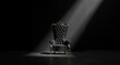 © ariful - Throne in Darkness: An antique throne sits majestically center stage, bathed in a dramatic beam of light against a deep, enveloping darkness.