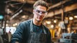 © Rodica - Worker wearing safety goggles and apron standing in workshop