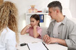 © New Africa - Little girl and her father having appointment with endocrinologist at white desk in clinic