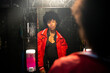 © Jenny Jungle/Stocksy - A beautiful woman in the bathroom of a party