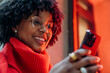 © DZ FILM/Stocksy - A woman using a mobile phone