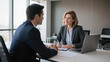 © Lumi Stock Studio - smiling businesswoman talking to male colleague in modern office, professional job interview between hr manager and candidate, corporate business partners discussing project at office desk